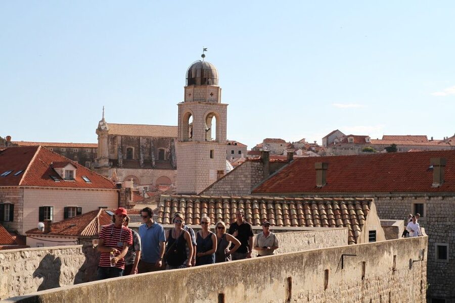 Dubrovnik: Old Town & City Walls Guided Tours Combo - The Old Port and the shift toward the walls