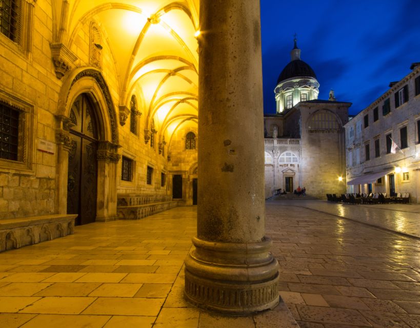 Dubrovnik: Old Town Highlights Guided Evening Walking Tour - Walking Stradun as the evening begins
