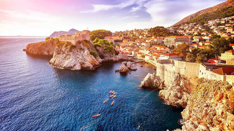 The Old Town walls of Dubrovnik dropping straight into the Adriatic