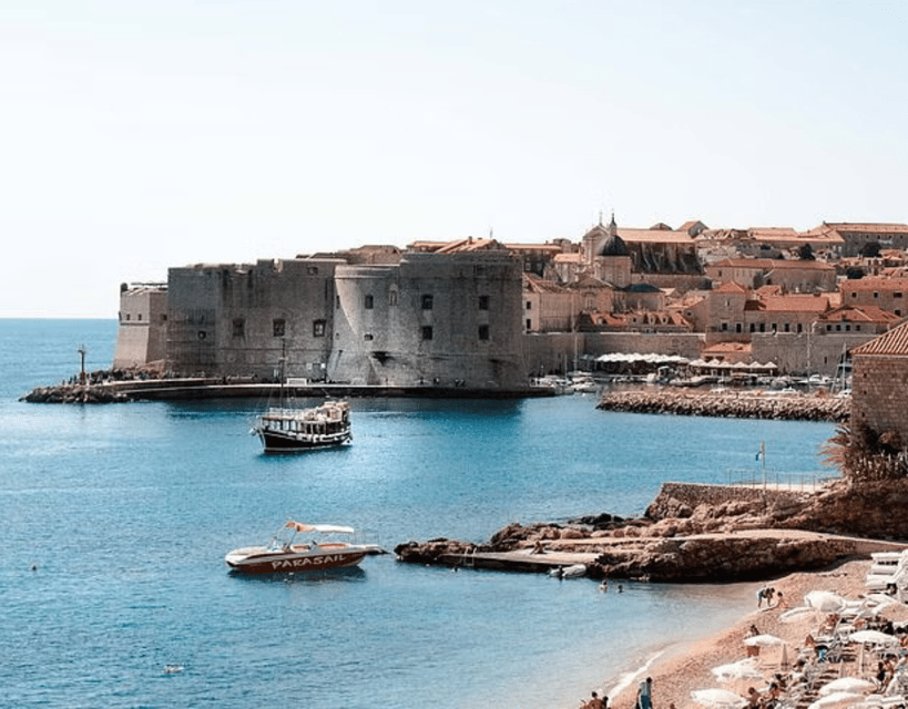 Sightseeing Boat Cruise in Old Town of Dubrovnik - Lokrum Island across the turquoise water